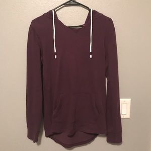 Plum colored sweatshirt.